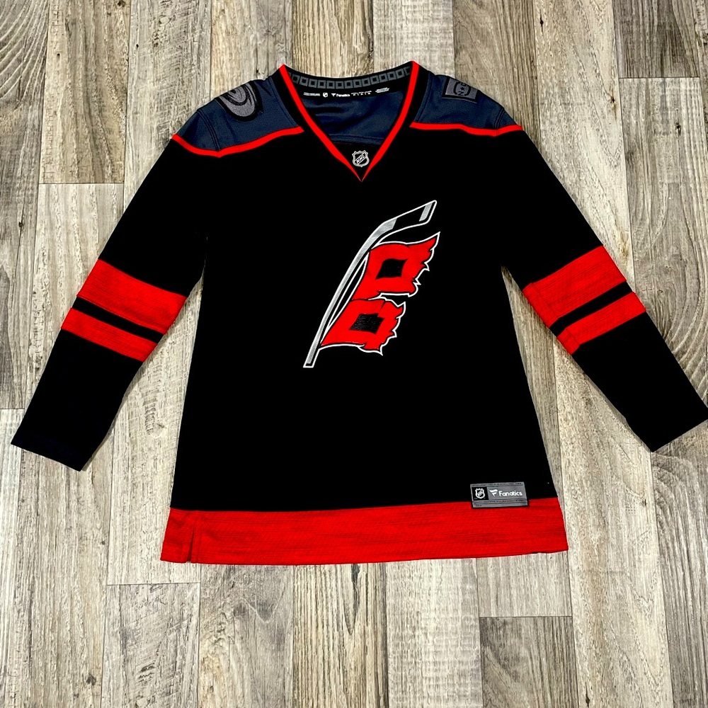 Women’s Carolina Hurricanes hockey jersey. Size medium.